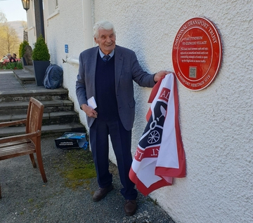 John Cameron CBE unveils Red Wheel plaque